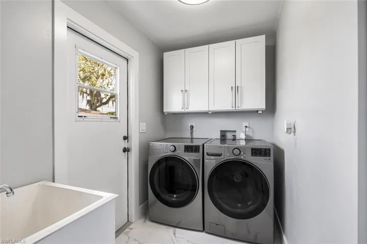 Laundry Room off of Kitchen has LG Full-Sized Washer and Dryer.  Laundry Tub. Side door to backyard.