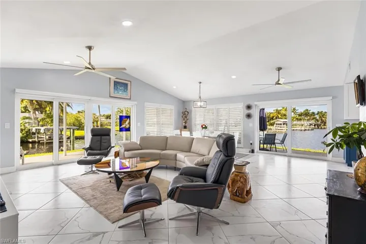 Porcelain tile 24" x 24" set on diagonal throughout home.  Window coverings are remote controlled blinds.  Volume ceilings and recessed lights are great features.