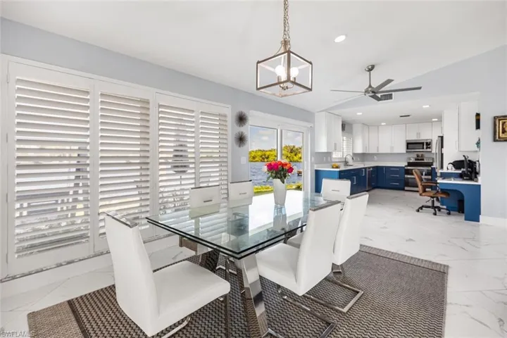 Conveniently located the dining  room is close to the kitchen.  Every view is to the water!