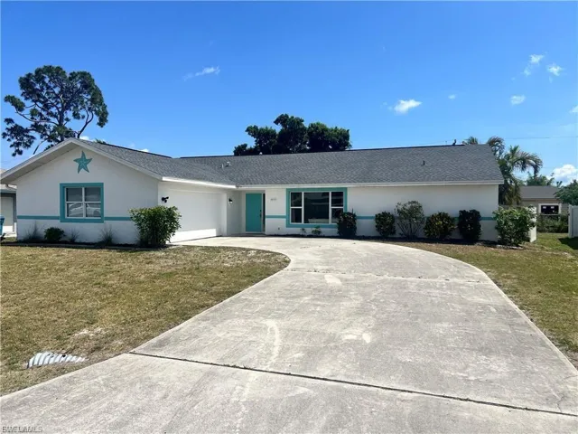 Single-story residence featuring a gray shingle roof, white exterior siding, and teal trim accents
