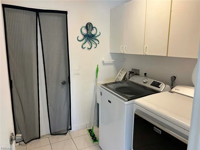 White upper cabinetry providing storage