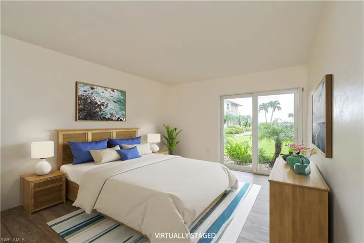 Bedroom featuring light hardwood / wood-style flooring and access to exterior