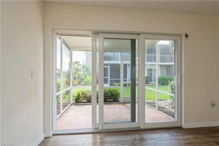 Entryway featuring a healthy amount of sunlight and hardwood / wood-style floors
