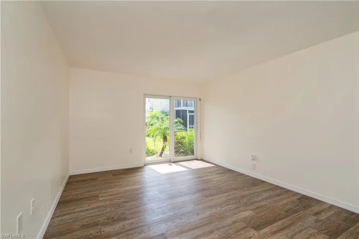 Spare room featuring dark hardwood / wood-style floors