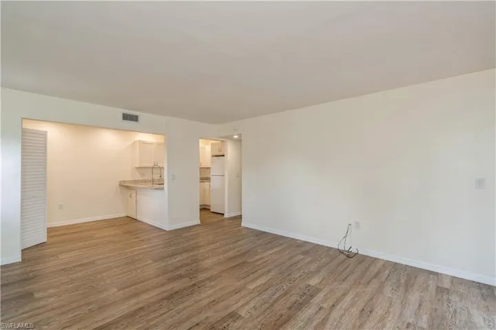 Spare room with sink and hardwood / wood-style floors