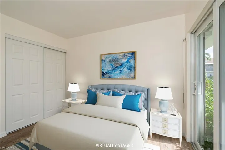 Bedroom with a closet and wood-type flooring