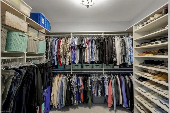 Spacious customized walk-in closet in Master Suite.