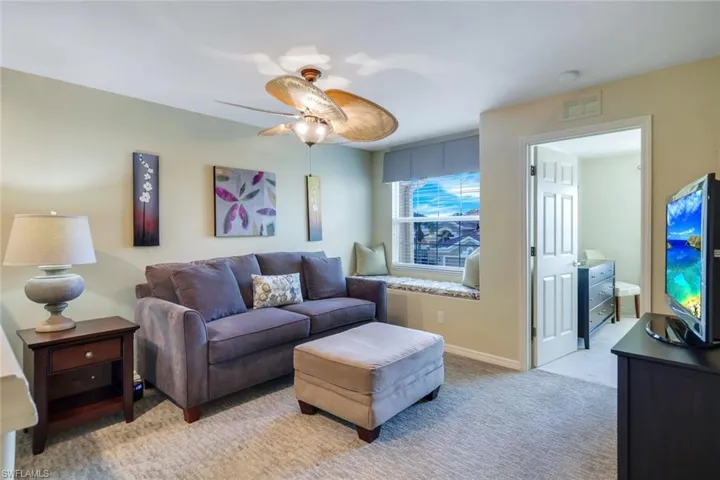 Loft/den area furnished with TV, sleeper sofa.