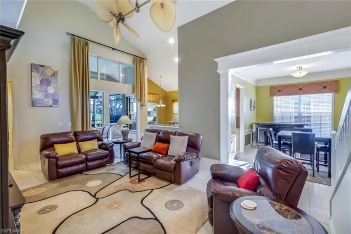 Living room, vaulted ceiling. Formal dining to right and kitchen and lanai to the left