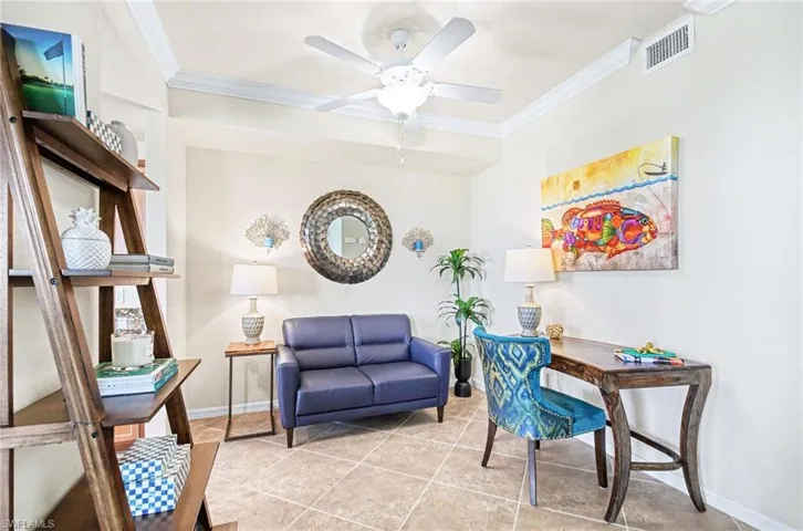 Neutral-toned room featuring tile flooring, crown molding, a ceiling fan, and recessed lighting