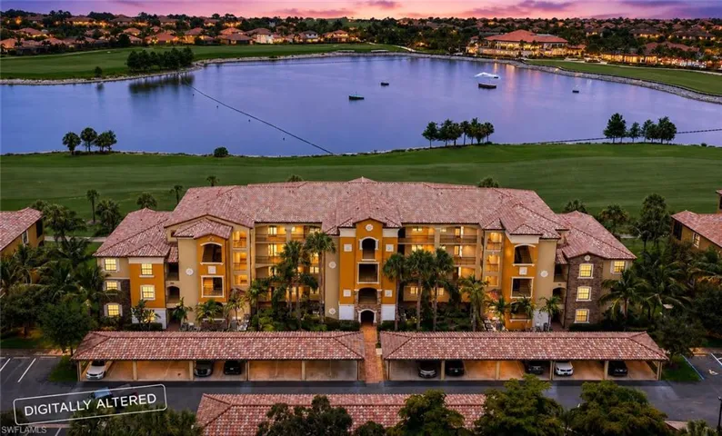 Multi-story building featuring Mediterranean-style architecture with a tile roof and stucco exterior