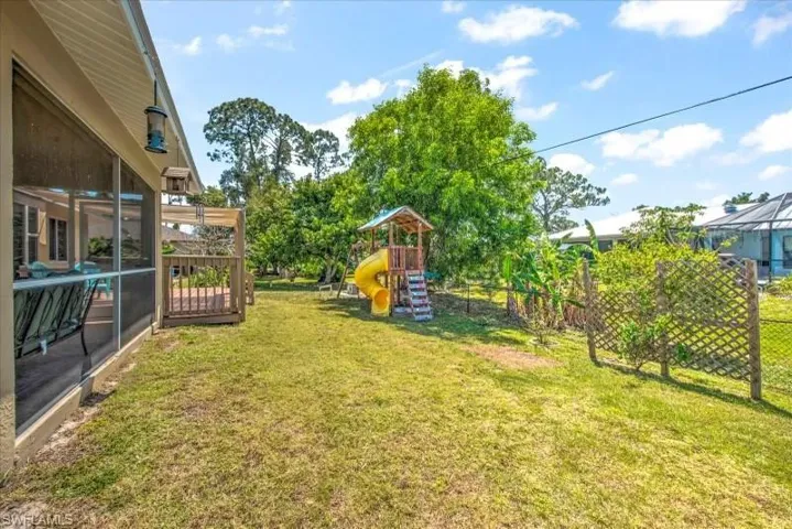 View of yard featuring a playground