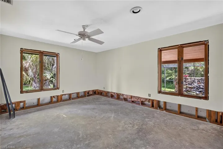 Third bedroom with two windows, one overlooking the waterfall
