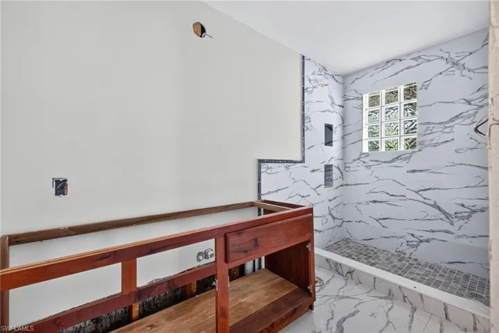 Guest Bath, tile, wood cabinetry