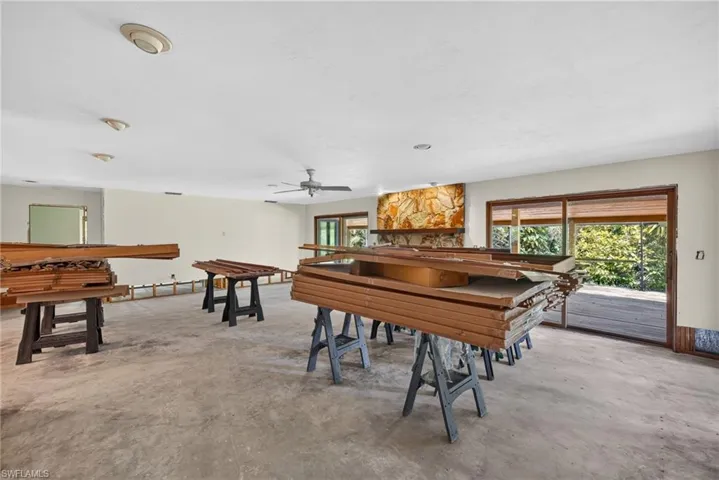 Original baseboards, door casings, and wood trim have been cleaned, sanded, and refinished and are stored in the living room.
