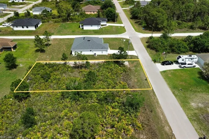 Expansive vacant lot featuring natural vegetation