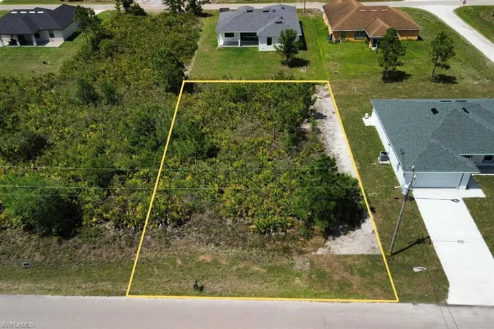 Cleared building lot with established surroundings