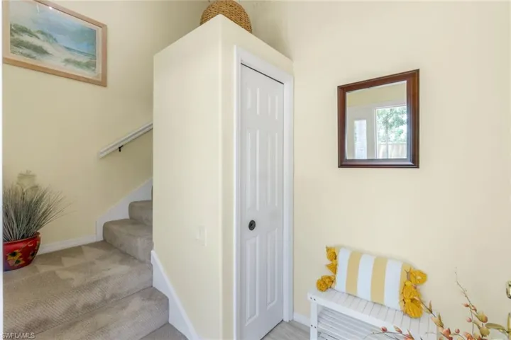 Stairway featuring baseboards and carpet floors