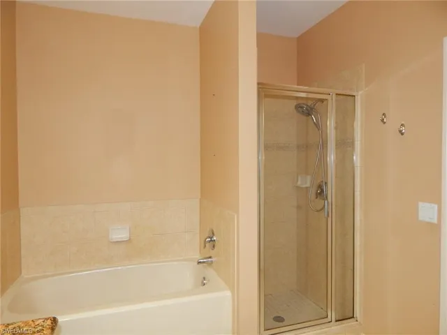 Bathroom featuring separate shower and tub