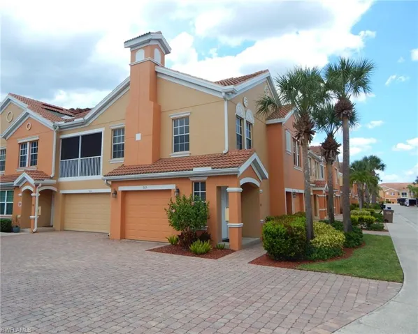 View of front facade featuring a garage
