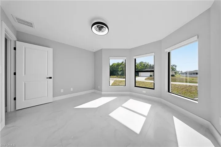 GUEST BEDROOM#1 bedroom with baseboards and light marble finish flooring