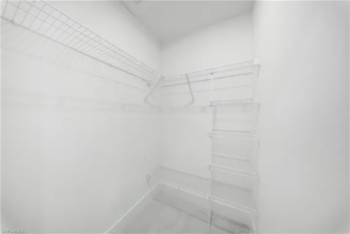 MASTER BEDROOM-Walk in closet #1 -with marble look tile flooring