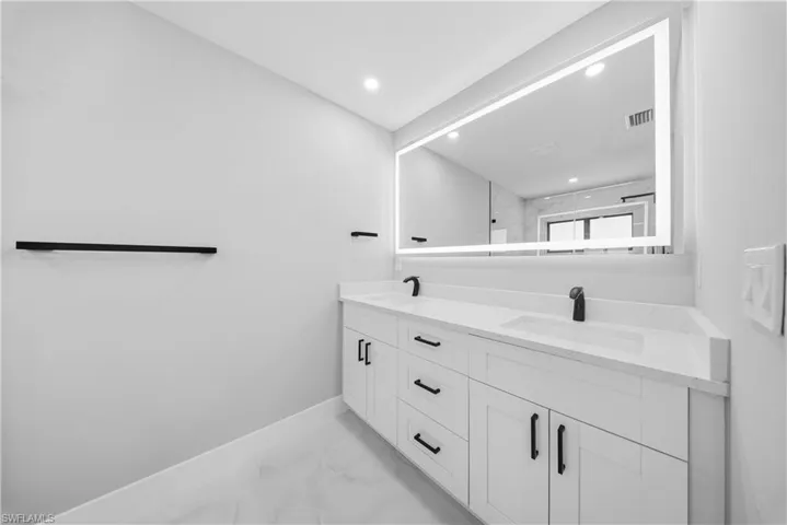 MASTER BATHROOM bath with SHOWER, light marble finish floors, double vanity, and recessed lighting