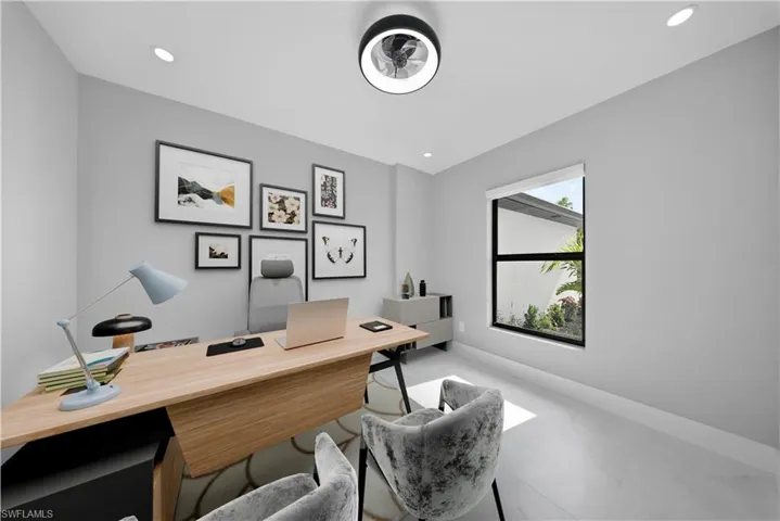 Office with baseboards and recessed lighting