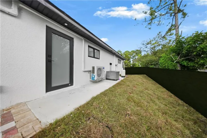 Fenced backyard with a patio