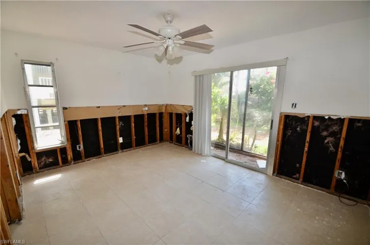 Master Bedroom with sliders leading to a small screen porch.