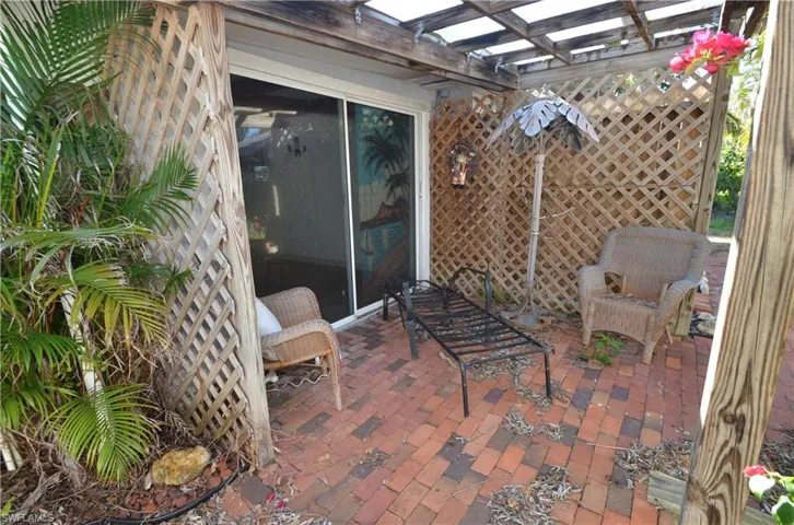 Patio off of sun room on the rear of the home.