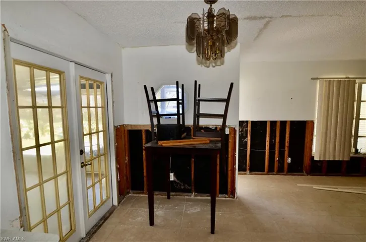 Dining area next to kitchen and sun room.