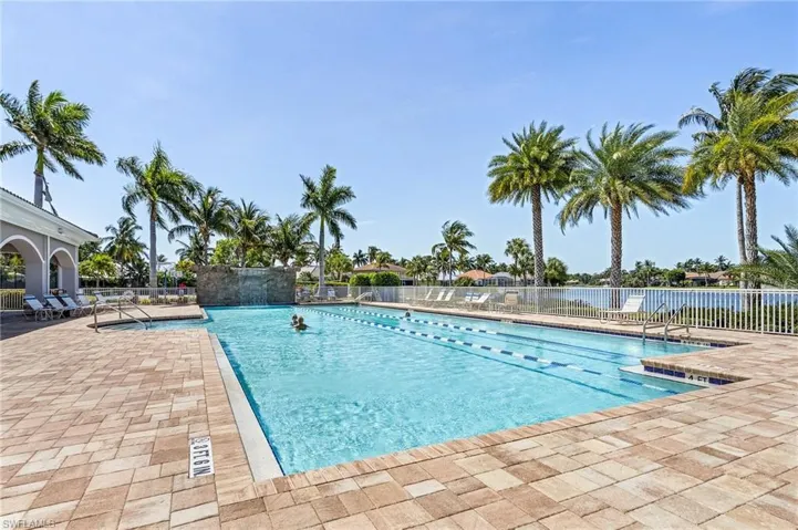 Community pool featuring a patio