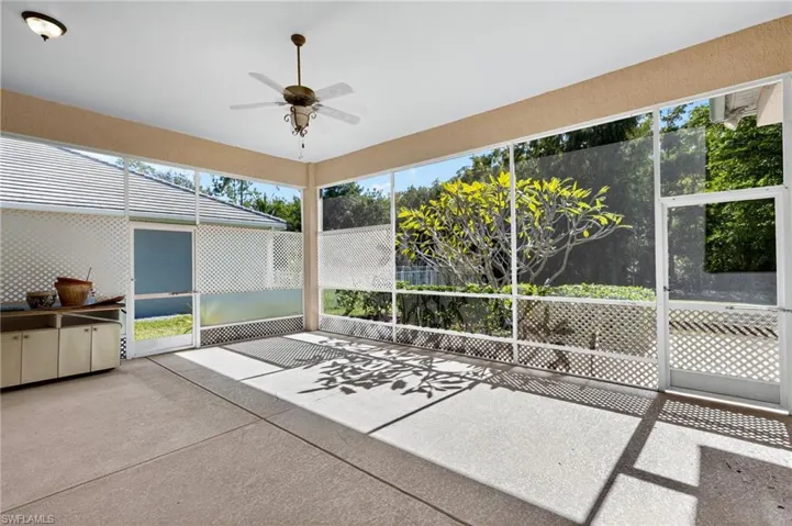Unfurnished sunroom with ceiling fan and healthy amount of natural light