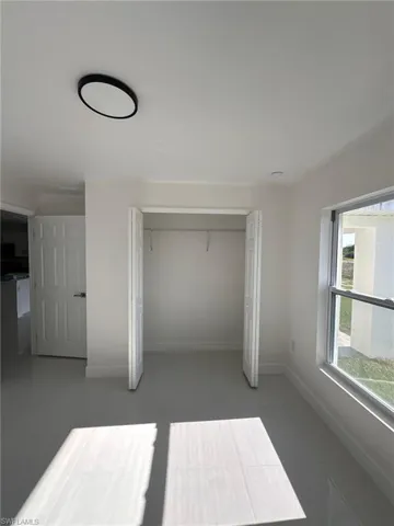 Unfurnished bedroom featuring a closet