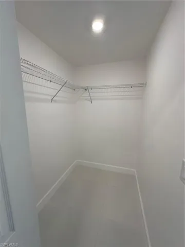 Spacious closet with tile patterned flooring