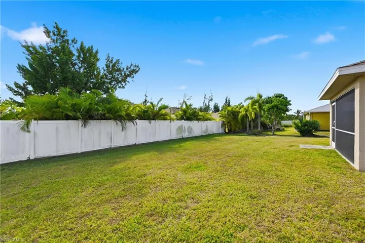 View of yard with a sunroom