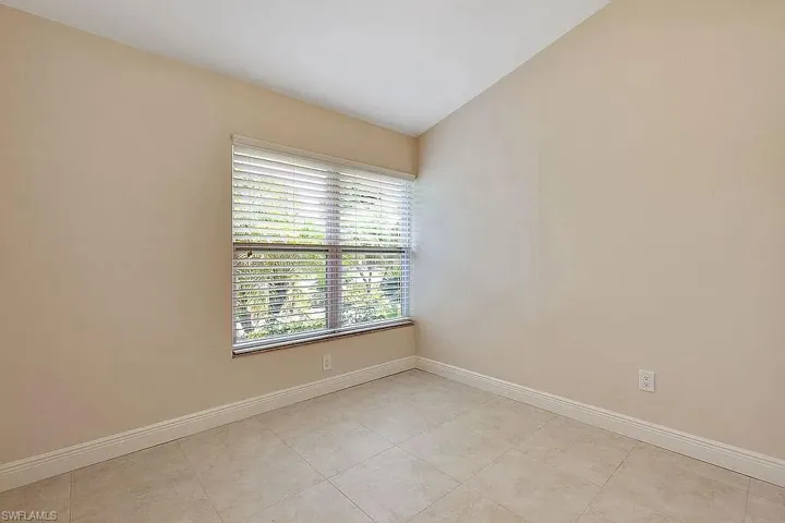 Unfurnished room with baseboards