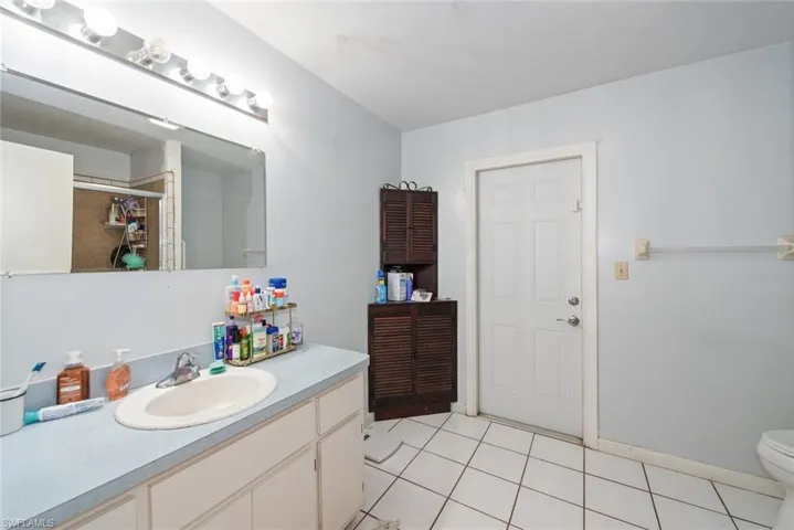Bathroom featuring vanity and light tile patterned flooring