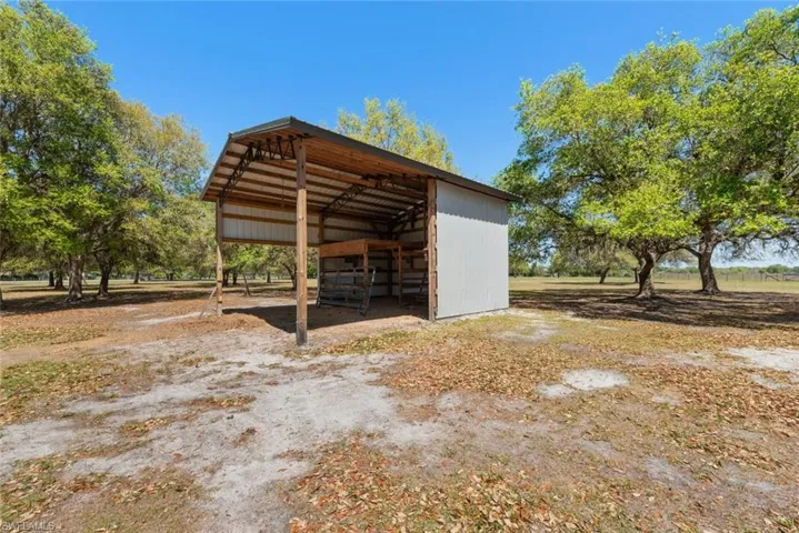 View of outbuilding with a carport