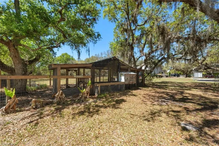 View of yard with exterior structure, an outdoor structure, and a detached carport