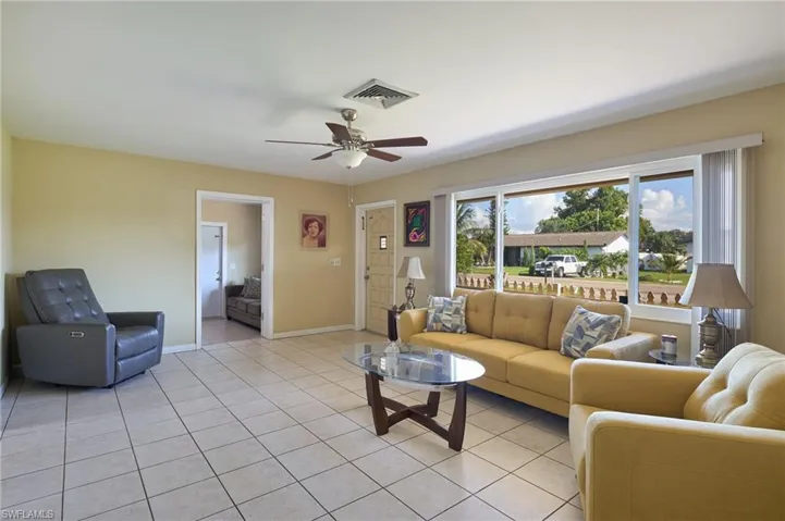 Tiled living room with ceiling fan