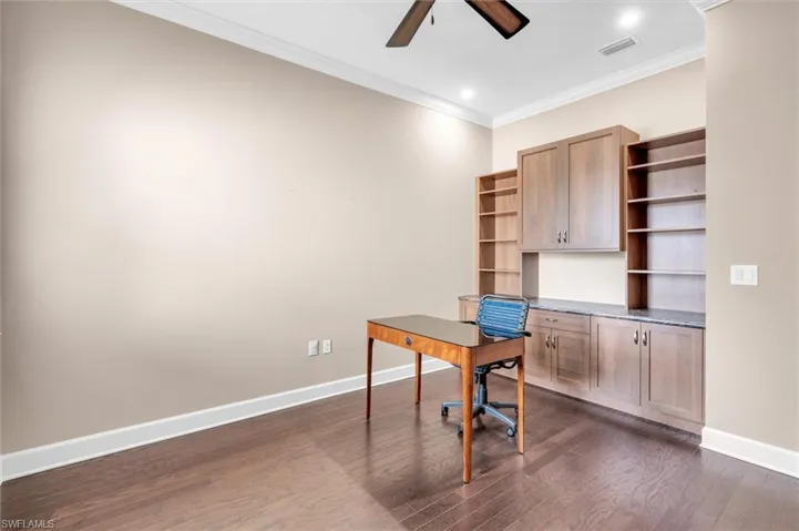 Den with custom built in cabinets