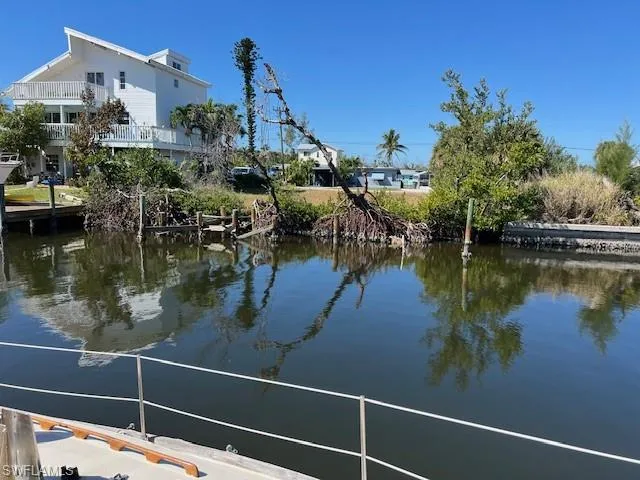 Dock area featuring a water view and a balcony