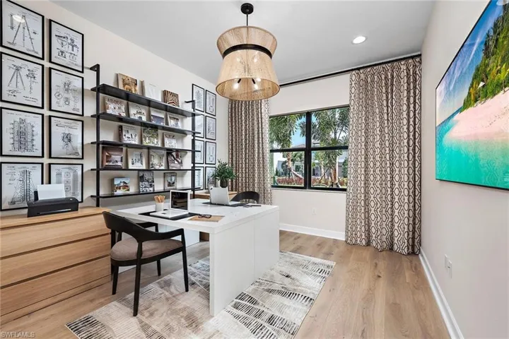 Office area with light wood-type flooring
