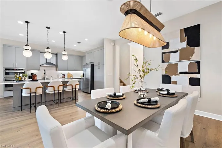 Dining space featuring light wood-type flooring and sink