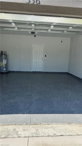 Garage featuring water heater