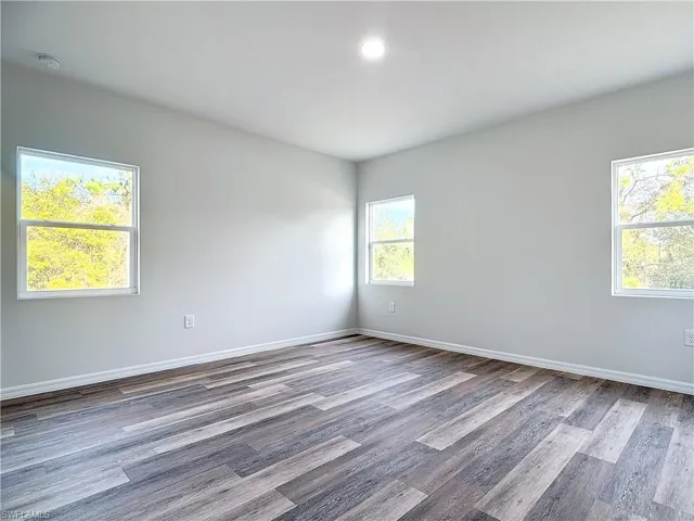Unfurnished room featuring light wood finished floors and recessed lighting