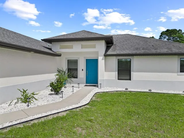718  Plumosa  AVE, Lehigh Acres, FL 33972