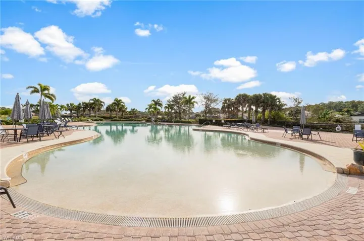 Community pool with a patio area